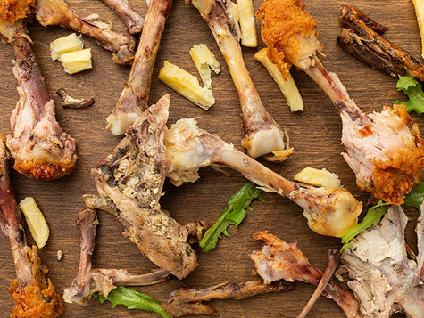 An array of turkey bones and vegetables. 