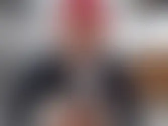 A constipated black and white dog is held by a veterinarian at VEG ER for Pets animal hospital