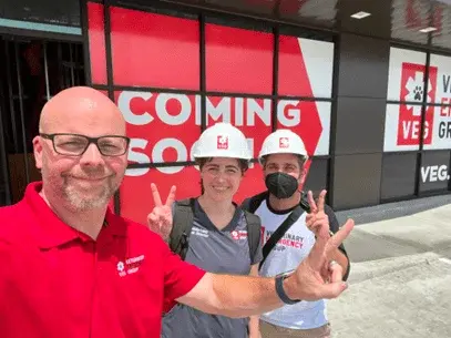 Employees of VEG ER for Pets wearing hardhats