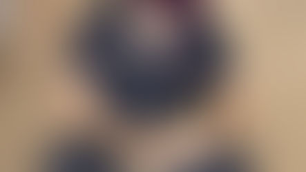 A Pug puppy who experienced shock is held by a VEG vet. 