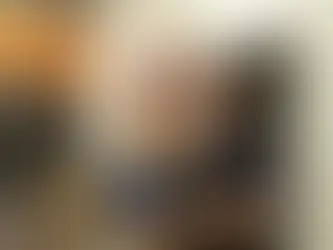 Golden fur dog looking up at veterinarian