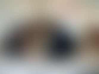 Dog is shaking as two vet professionals attend to symptoms.