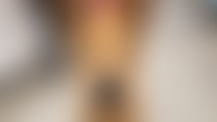 Dog with rreddish gold fur and a sad expression looks at camera. 