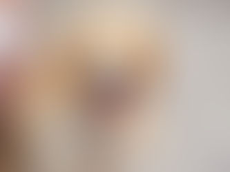 A large golden dog sits on the floor panting