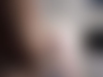 A white fluffy cat that has been vomiting is being seen by the vet
