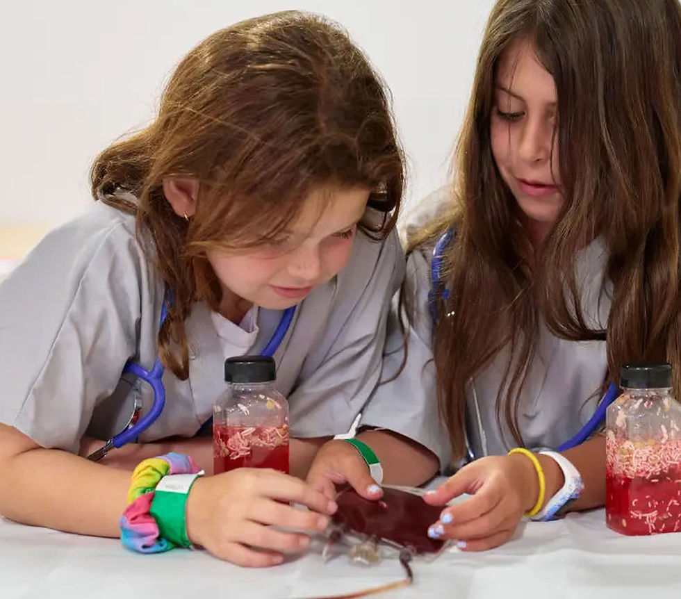 Two Little Vet students working on a project together